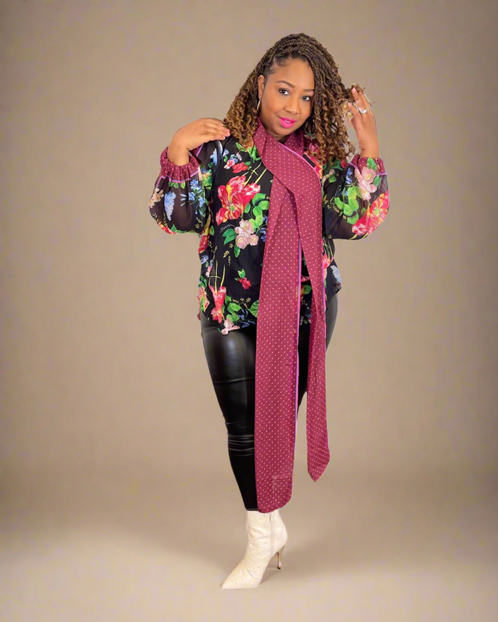 Step into style with the Floral Allure Bow Top — a chic floral blouse featuring a statement burgundy bow and sheer sleeves. Perfect for bold, feminine looks.