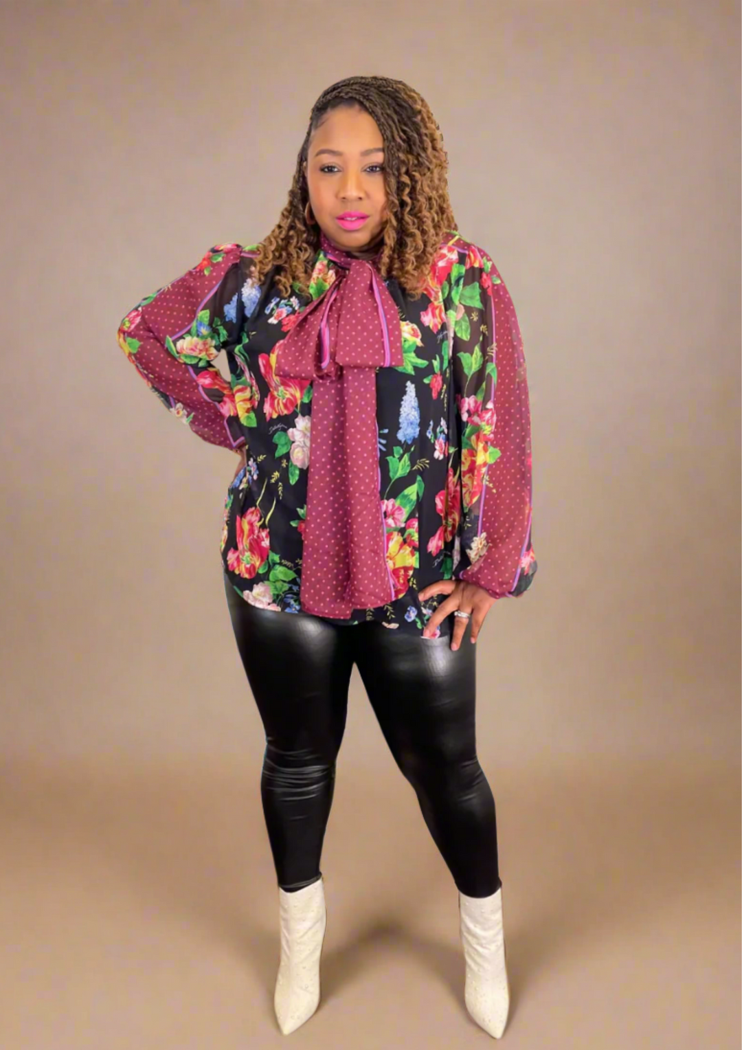 Step into style with the Floral Allure Bow Top — a chic floral blouse featuring a statement burgundy bow and sheer sleeves. Perfect for bold, feminine looks.
